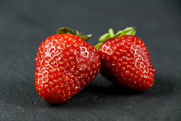 fresh strawberries on gray background