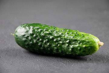 fresh cucumber on gray background