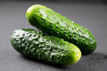 fresh cucumber on gray background