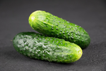 fresh cucumber on gray background