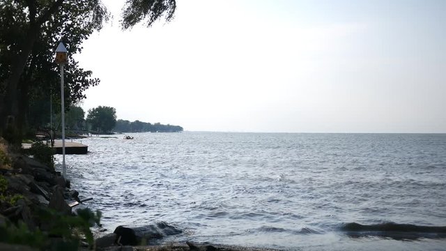 A large body of water near a coastal community in summer