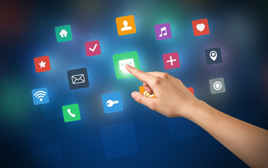 Female hand touching colorful applications