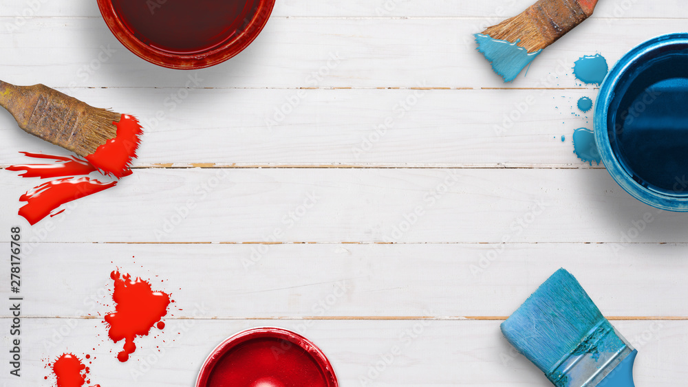 Poster red and blue color boxes, brushes and color drops on white wooden table. diy, painting craft concept