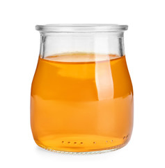 Tasty jelly dessert in glass jar on white background