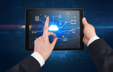 First person view of a hand using tablet with cloud office concept