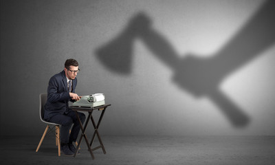Shadow threatening hard worker man who is afraid