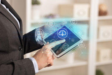 Business woman using tablet with network security and online storage system concept