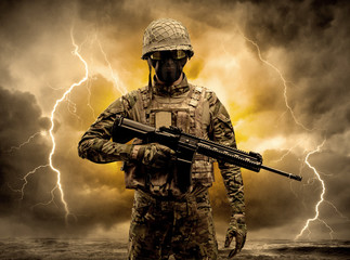 Armed soldier standing in rainy obscure weather