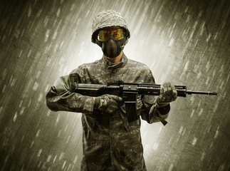 Armed soldier standing in rainy weather