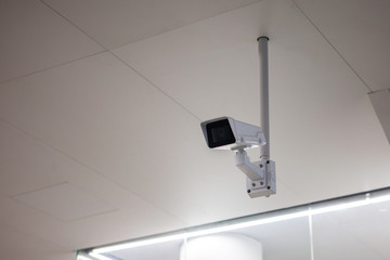CCTV camera in the subway room, public place, security and video surveillance.