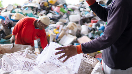 Workers are sorting plastic waste in the garbage factory