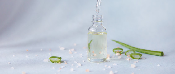 Dropper glass bottle with pipette. Mock up Essential liquid with aloe vera .