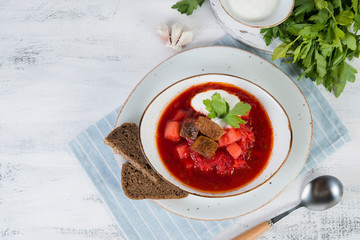 Traditional Ukrainian borsch with beef and sour cream