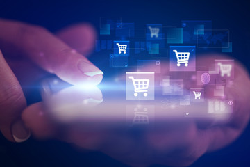 Finger touching phone with online shopping concept and dark background