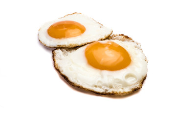 Fried eggs isolated on white background