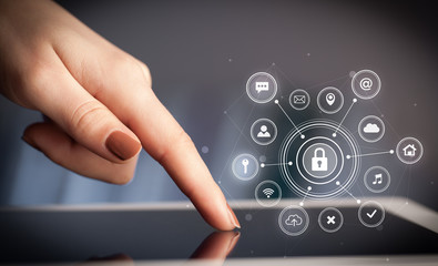 Hand holding tablet with online security concept