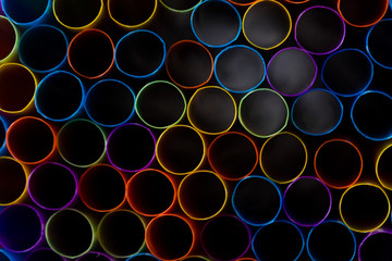 Abstract composition of colorful plastic straws seen from above, concept accessories to celebrate your party