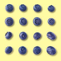 Set or collection of fresh blueberries over yellow background