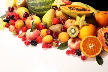 Fresh summer fruits with apple, peach, papaya, berries, pear and apricot.