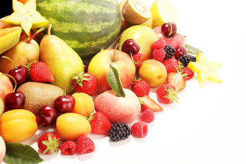 Fresh summer fruits with apple, peach, papaya, berries, pear and apricot.