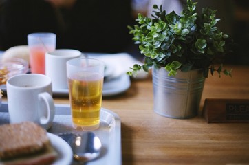 food water cup grass table