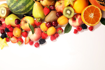 Fresh summer fruits with apple, peach, papaya, berries, pear and apricot.