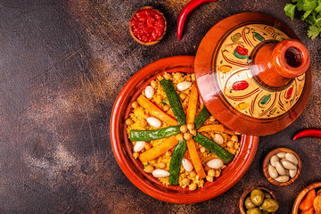 Fototapeta na wymiar Vegetable tagine with almond and chickpea couscous