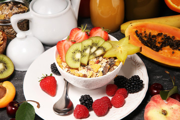 Healthy breakfast. Bowl of yogurt with granola and berries, fresh fruits and smootihies