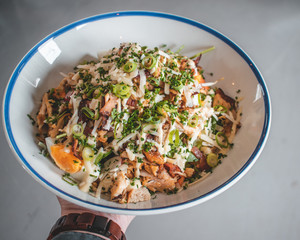 Delicious caesar salad and goatcheese salad on wooden table