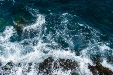 Fototapeta na wymiar The waves in the sea background