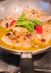 Sautéed cod with tomato, raisins, pine nuts, celery, red onion, oil, pepper and olives and olives