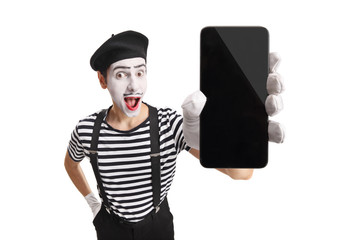 Excited mime showing a mobile phone