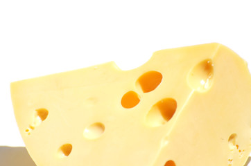 Close-up piece of cheese isolated on white background, food photo