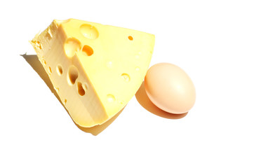 still life piece of cheese and egg isolated on white background, food photo