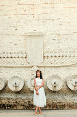 young beautiful candid woman in white dress , street style