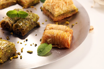 Middle eastern or arabic dishes. Turkish Dessert Baklava with pistachio on dishes