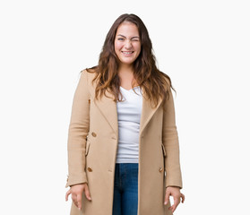 Beautiful plus size young woman wearing winter coat over isolated background winking looking at the...