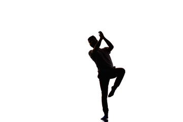 Handsome breakdancer does a common dance pose isolated on white