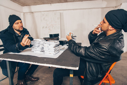 Adult thiefs counting cash