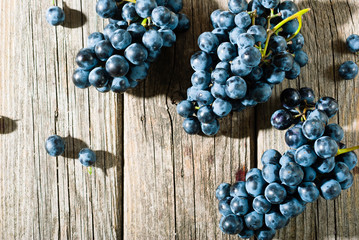 red grapes on old weathered wooden table