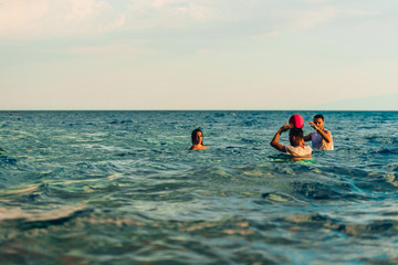 Waterpolo players in action during a match in sea