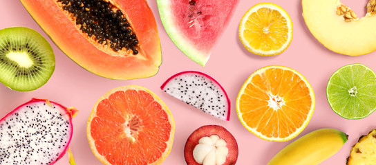 Creative layout made of papaya, grapefruit, lemon, kiwi, melon, watermelon, banana, pineapple,...