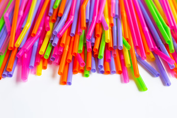 Colorful plastic  straws on white background.