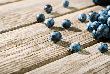 red grapes on old weathered wooden table