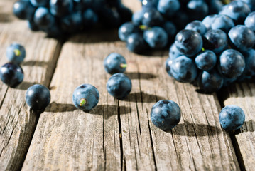 red grapes on old weathered wooden table