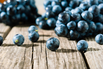 red grapes on old weathered wooden table