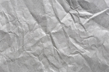 Old crumpled dark grey paper background texture