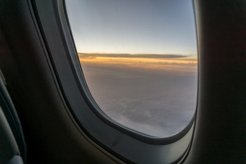 view from aircraft window during sunrise