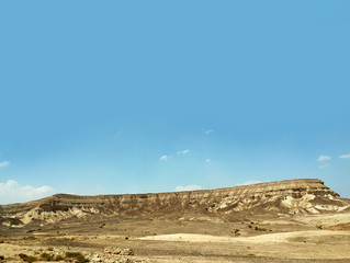 Desert land landscape with rocks, hills and mountains