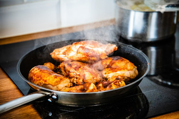 Fried chicken legs in pan 